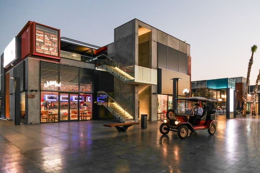 The BOXPARK serves as a novelty in itself because of its part concrete, part container infrastructure.