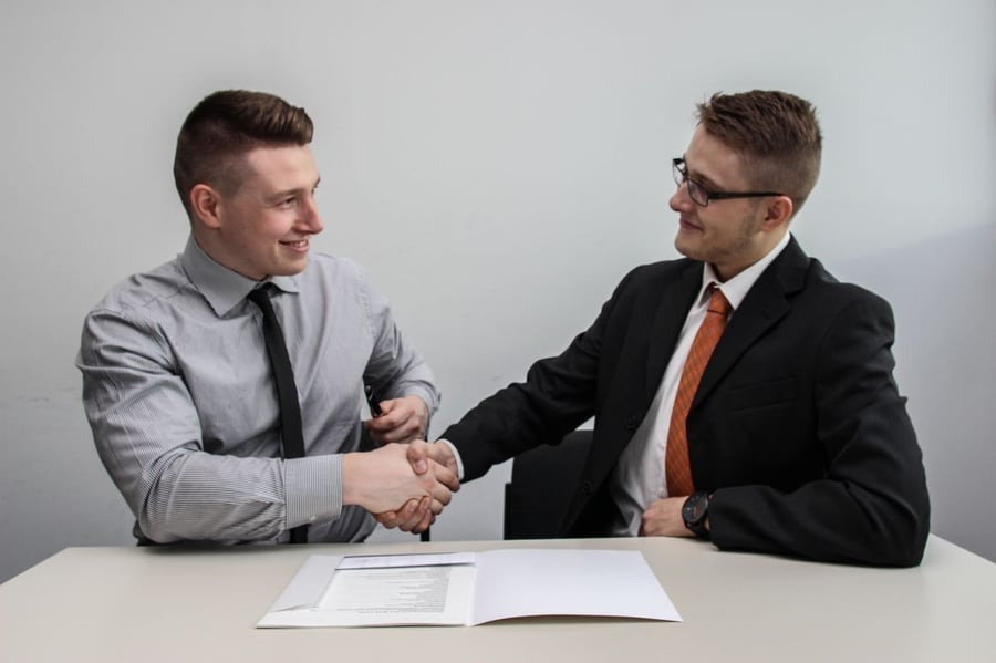 Property conveyancing in Dubai | two men shaking hands